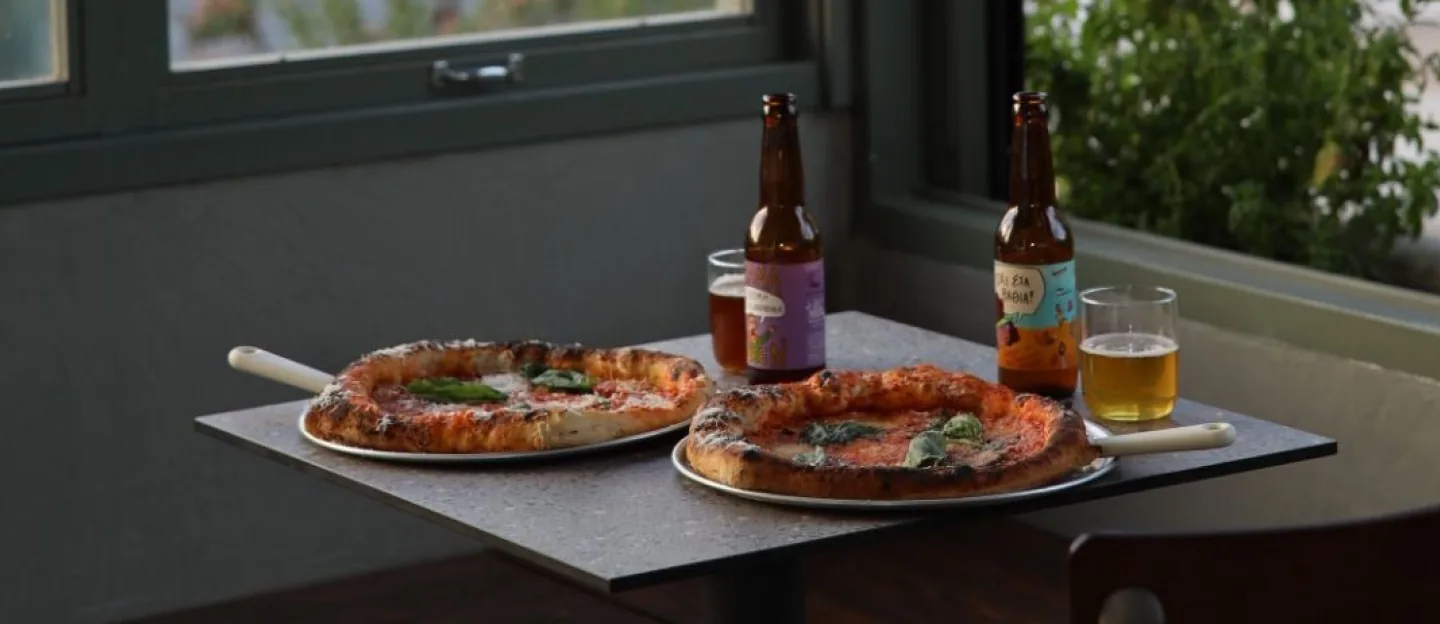 Pizzas and drinks by the window